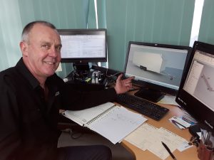 Trailer designer and builder Colin Hitchens shows a computer design of a bespoke trailer to a customer over the Internet