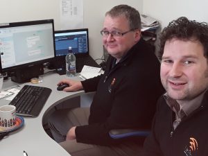 Glenn Hutton (left) and Travis Baird in Unifone’s Balclutha office.